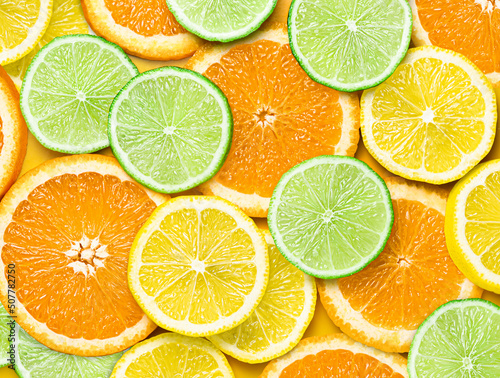 Canvastavla background of sliced orange lemon and lime slices