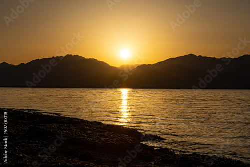 Sunrise view of Jordan from Eilat Israel across the Red Sea 