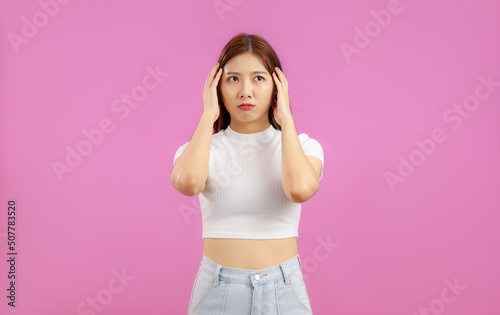 Portrait of Asian Woman thinking over isolated pink background, people emotional concept © CREATIVE WONDER