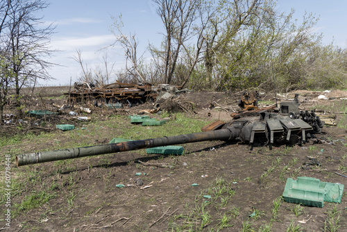 Burnt tank, armored personnel carrier, city of Ukraine. Destroyed cities. Demilitarization of Russia in the war