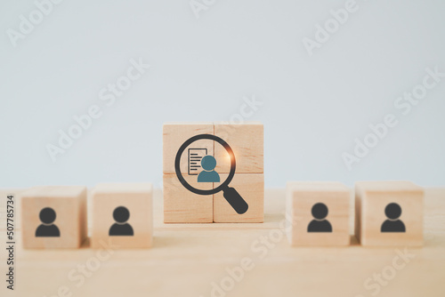 wooden cube blocks with buyer information in magnifying glass  ,buyer persona and target customer concept, Customer psychology profile or characteristics, Marketing analysis for business plan