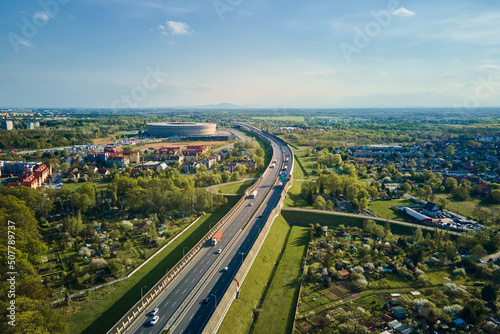 Aerial view of Wroclaw cityscape with residential districts, stadium and car traffic road