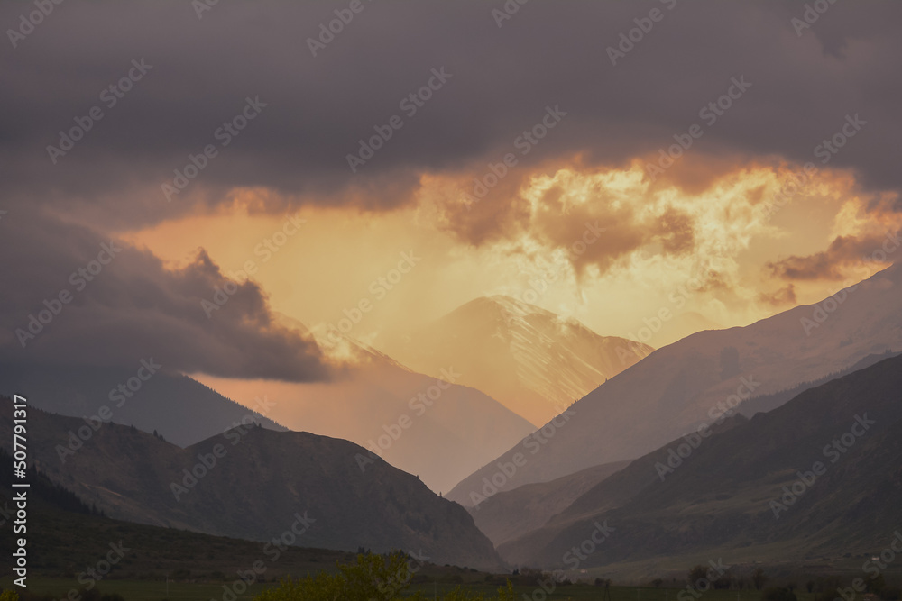 Landscape with cloudy sunset over mountains in Kazachstan.