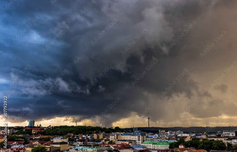 Storm spinning over the city, dramatic storm clouds in Lithuania, Europe