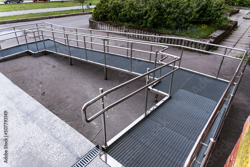 A ramp for people with disabilities near a public building. photo