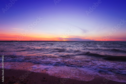 Sunrise over the river with clouds on the horizon © pobaralia