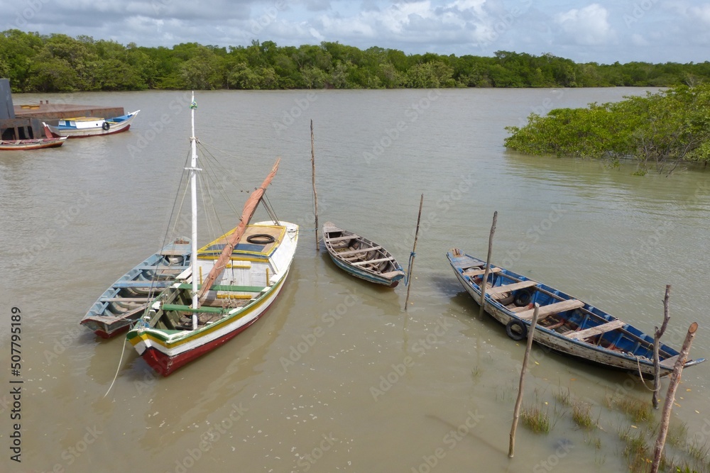 Fishing boats moored in a river, isolated in Alcântara, Maranhã, Brazil.
