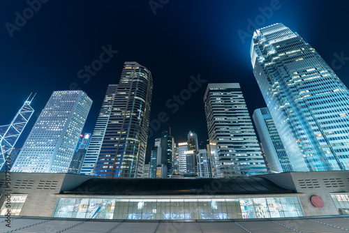 Photography Modern office building and skyline of Hong Kong city at night