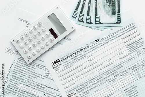 Annual tax form under US law with money cash. Tax payment season