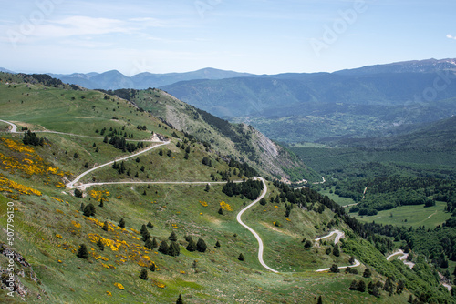 View of a mountain road on a sunny day at the Col de Pailheres, France.
