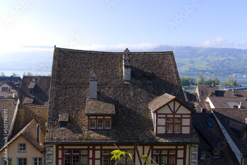 Aerial view of the old town of City of Rapperswil with Swiss Alps in the background on a sunny spring day. Photo taken April 28th, 2022, Rapperswil-Jona, Switzerland.