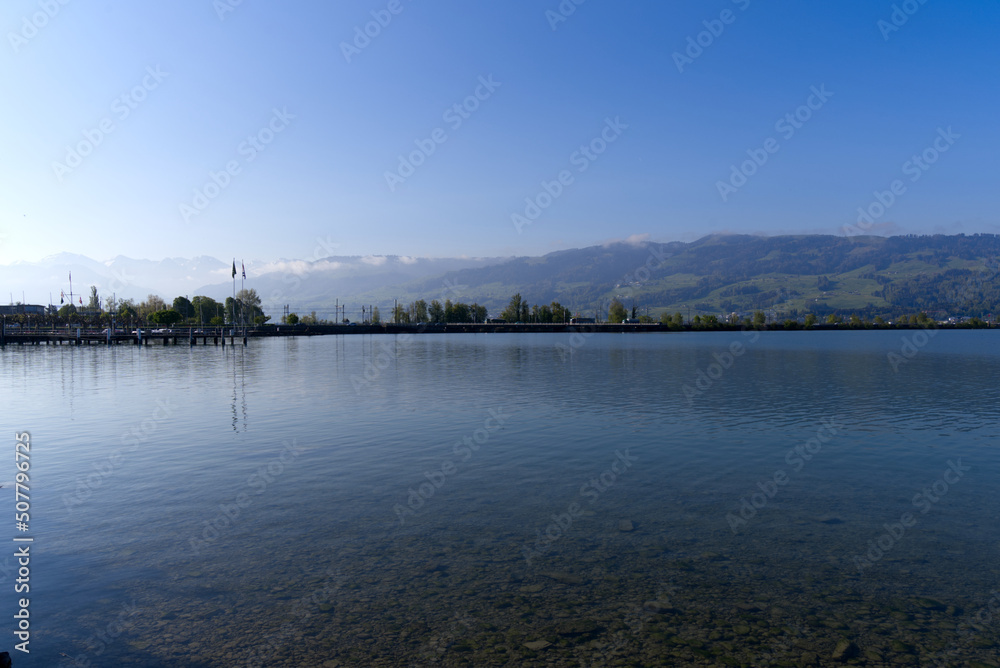 Scenic landscape with Lake Zürich seen from City of Rapperswil-Jona on a sunny spring day. Photo taken April 28th, 2022, Rapperswil-Jona, Switzerland.