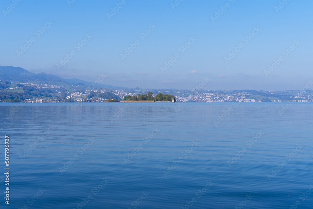 Fototapeta premium Scenic landscape with Lake Zürich seen from City of Rapperswil-Jona on a sunny spring day. Photo taken April 28th, 2022, Rapperswil-Jona, Switzerland.