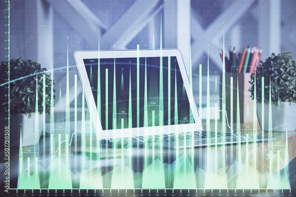 Forex market graph hologram and personal computer on background. Multi exposure. Concept of investment. Forex market graph hologram and personal computer on background. Multi exposure. Concept of investment.