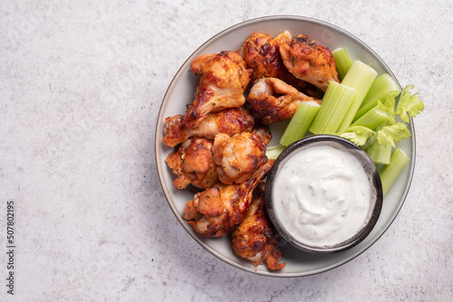 buffalo chicken wings with celery and ranch sauce