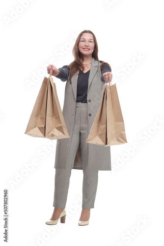 in full growth. elegant woman with shopping bags.