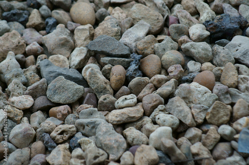 River stones on the river bank. Background image. River stones on the river bank. Background image.