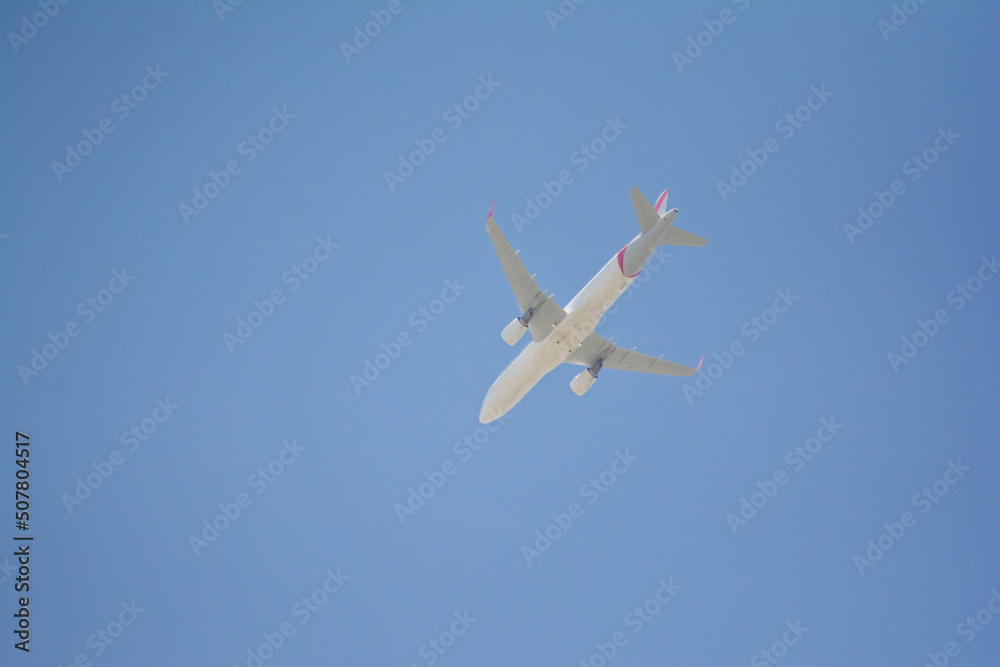 Airplane in the sky. Passenger plane on blue sky Airplane in the sky. Passenger plane on blue sky
