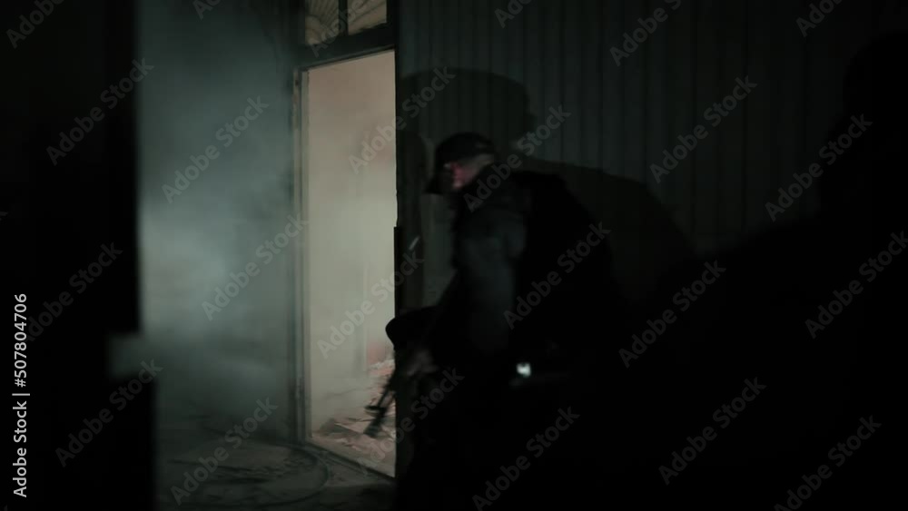 A soldier throws a grenade inside the room. A soldier throws a grenade inside the room.