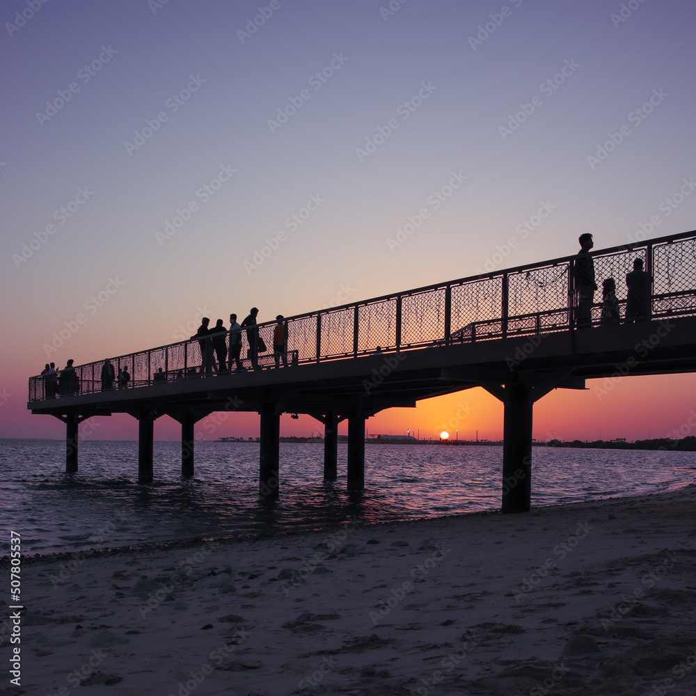 sunset view at the pier in abu dhabi island beach, UAE