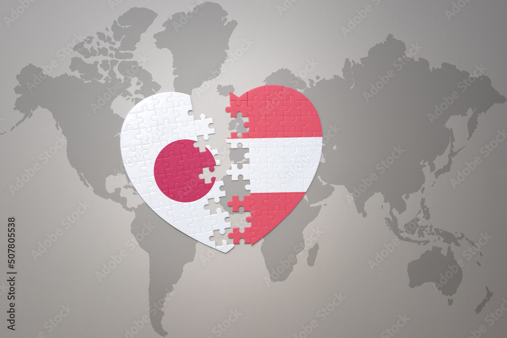 puzzle heart with the national flag of japan and austria on a world map background. Concept. 3D illustration puzzle heart with the national flag of japan and austria on a world map background. Concept. 3D illustration