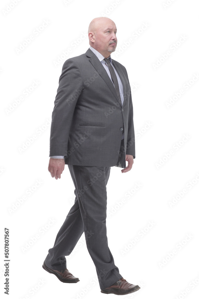 Mature business man striding forward .isolated on a white background. Mature business man striding forward .isolated on a white background.
