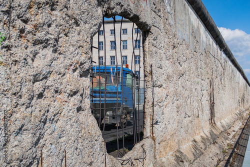 Photography hole in berlin wall with truck
