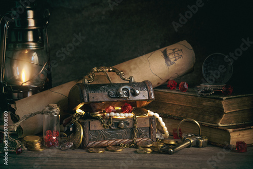 a chest with pirate treasures and jewels on a wooden table in the captain's cabin in retro style, the concept of adventure and treasure hunting