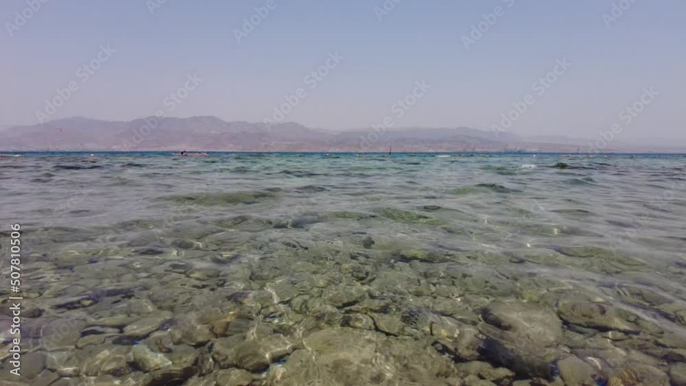 Clear waters of the Red Sea with the Aqaba Mountains Clear waters of the Red Sea with the Aqaba Mountains