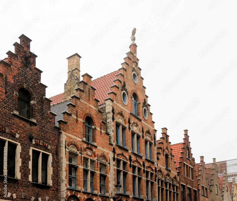 ancient houses with gabled facades in the medieval part of the town Bruges, Belgium