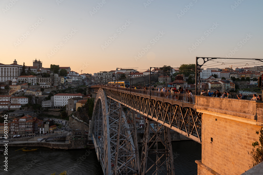 Fototapeta premium People on the Bridge over the Douro Luis II River in Porto, Portugal in Summer 2022.