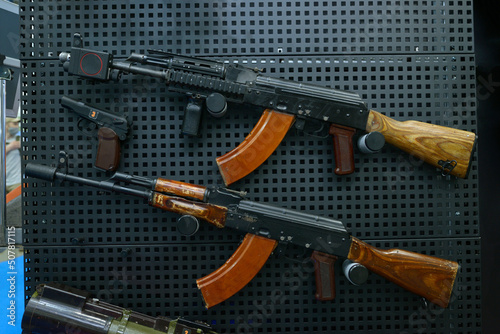 Fotografie, Obraz Assault rifles put on stand, gun shop