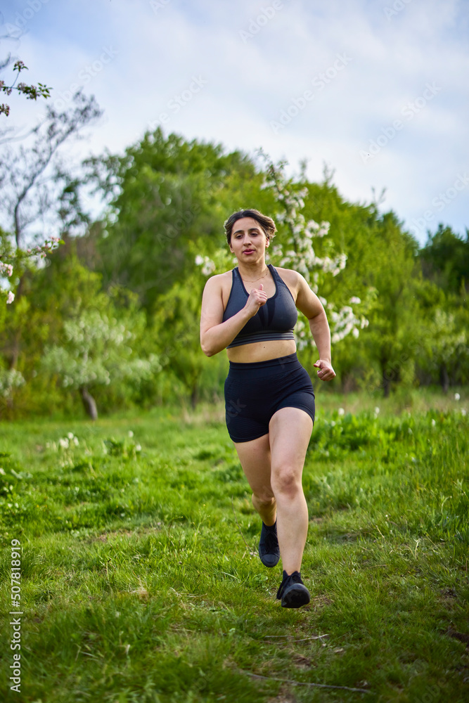 portrait of a strong woman training in nature portrait of a strong woman training in nature