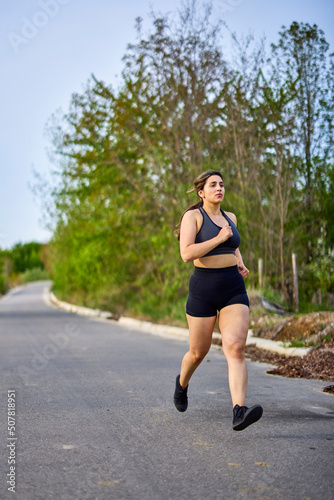 portrait of a strong woman training in nature