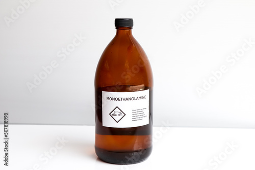 monoethanolamine in bottle, chemical in the laboratory photo