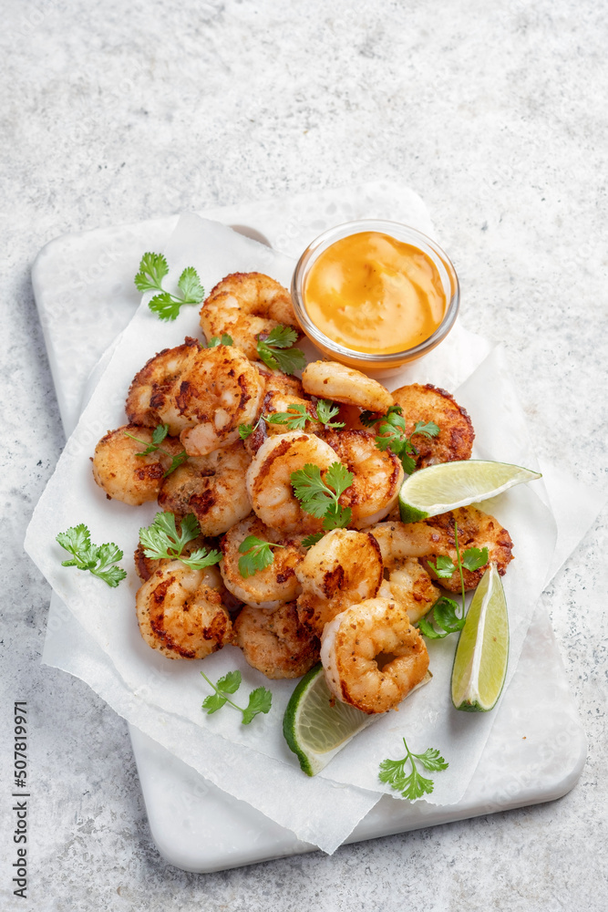 Prawns Shrimps roasted with lemon and garlic on white background Prawns Shrimps roasted with lemon and garlic on white background