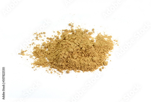 Dry ginger powder isolated on white background. Pile of dry ginger powder in a scoop.
