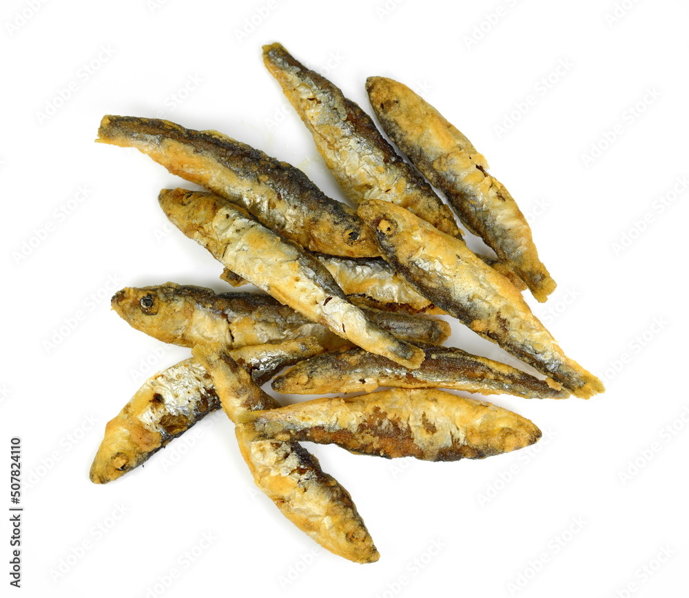 Deep Fried small Fishes Isolated On White Background. Simply food ,simply cooking - fried anchovies. Deep Fried small Fishes Isolated On White Background. Simply food ,simply cooking - fried anchovies.