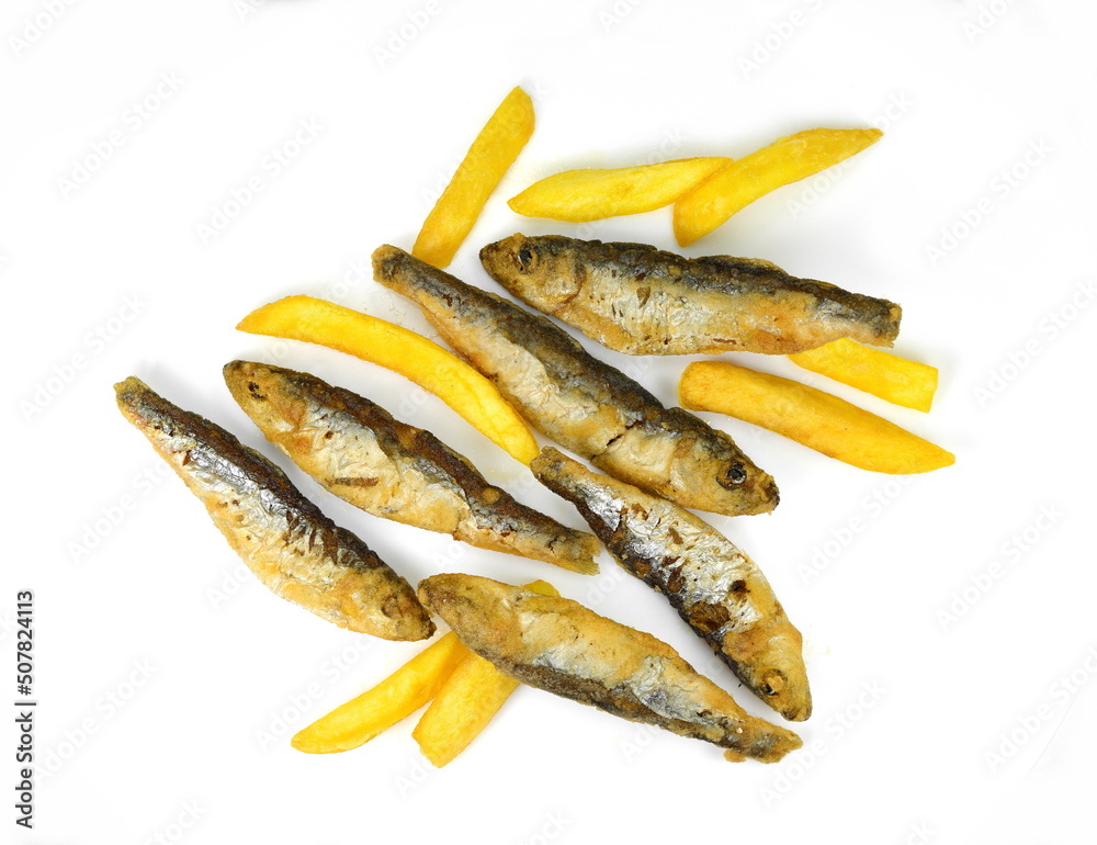 Deep Fried small Fishes Isolated On White Background. Simply food ,simply cooking - fried anchovies with potatoes. Deep Fried small Fishes Isolated On White Background. Simply food ,simply cooking - fried anchovies with potatoes.