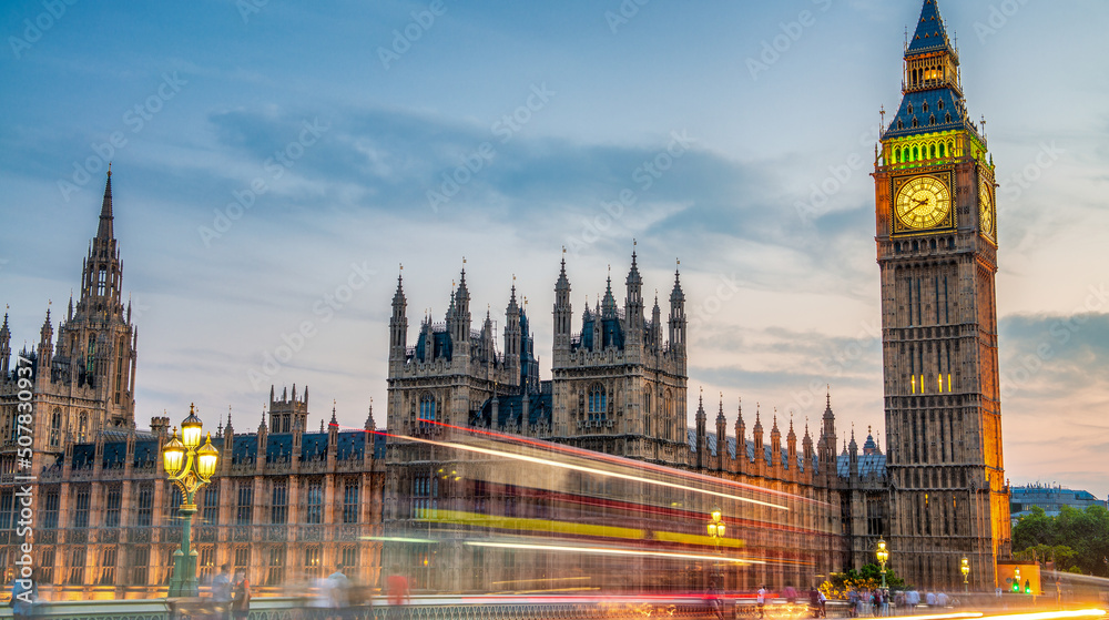 Fototapeta premium LONDON, UK - JULY 1ST, 2015: Westminster Palace along river Thames at sunset, view from Westminster Bridge.