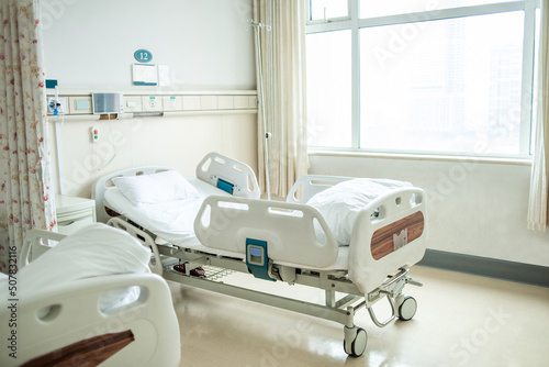 Empty bed in hospital ward
