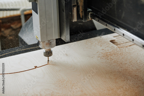 Canvastavla Close up of CNC engraving machine cutting wood in automated production workshop