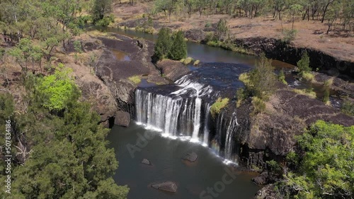 Millstream Falls waterfall backward aerial in Atherton Tablelands, Queensland, Australia photo