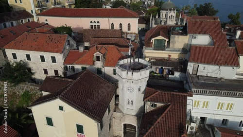 Aerial View of Sahat Kula, Clock Tower in Downtown Herceg Novi, Montenegro, Drone Shot photo