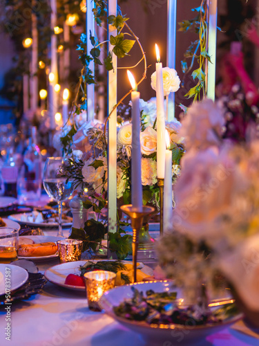 Tela Table served for banquet with candles and floral compositions