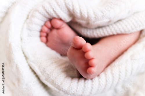 Baby feet in bed