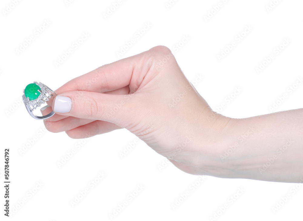 Female hand with green ring on white background isolation