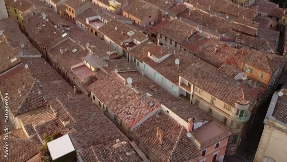 View of a historical village during a sunset in Italy. View of a historical village during a sunset in Italy.