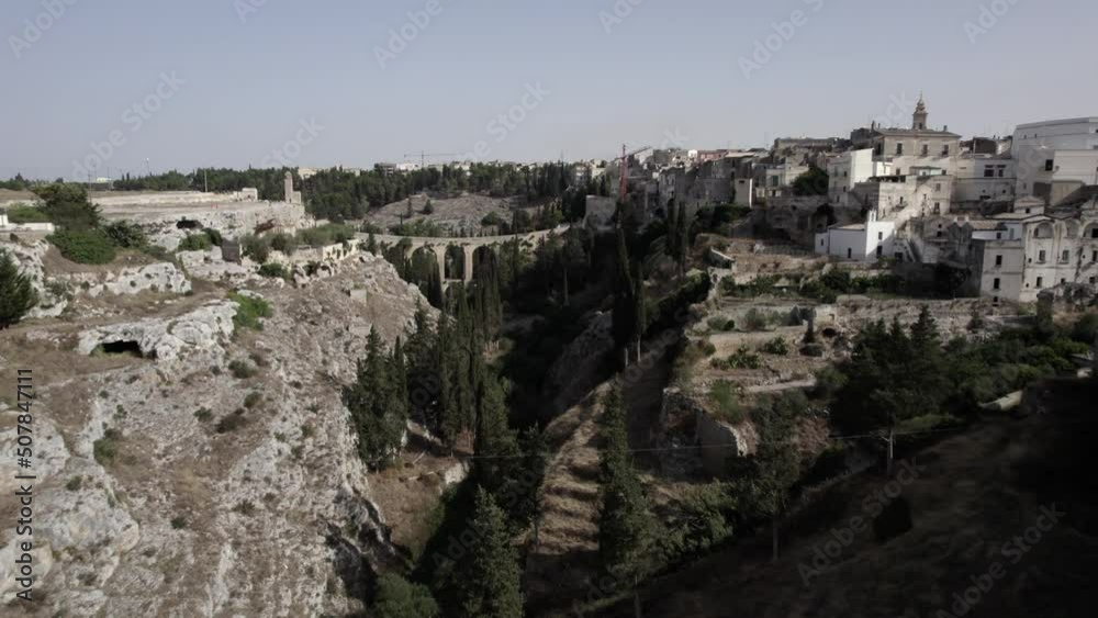 drone video of empty descriptive plane between the aqueduct of the town Gravina in Puglia heading towards the roman bridge. drone video of empty descriptive plane between the aqueduct of the town Gravina in Puglia heading towards the roman bridge.