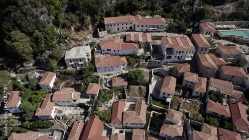 drone video of previous revealing shot over the village of Nje Muaj, Spile, Sen in Himare, on the Albanian coast, laSh8.
The shot ends with the entire town as the main stage, a church, photo